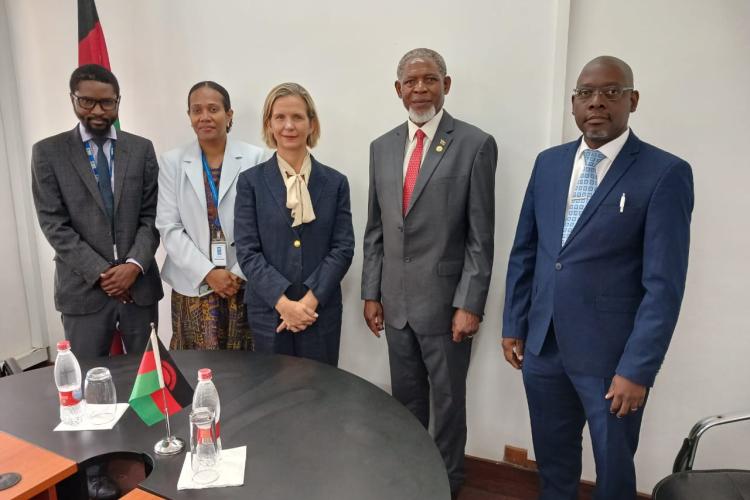 Hon. Titus Mvalo and UNDP Representatives.