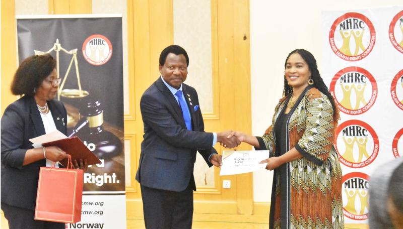 Minister Honours Outgoing MHRC Commissioners